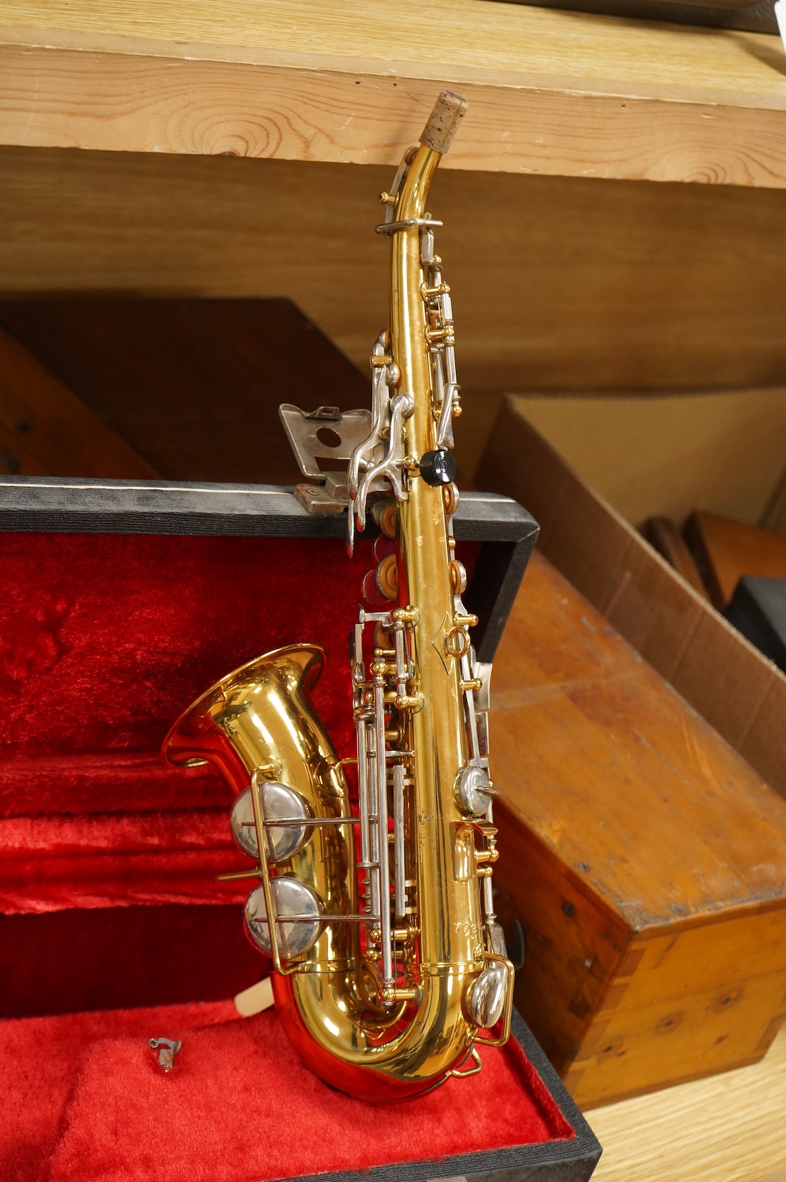 A cased Borgani soprano saxophone